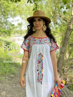 This Beautiful Floral Dress is Fun and completely embroidered by hand. It's perfect for a fun day out or even a formal event! This dress is truly a work of art! The Mexican artisan takes more than one month hand embroidering every gorgeous detail on this dress. The earrings you can buy too and find here. https://www.etsy.com/es/listing/637147293/filigrana-redonda-filigrana-clasica?ref=shop_home_active_4&pro=1&frs=1 Hand Embroidered Dress, Traditional Mexican Dress, Wedding Dress Prices, Dress Traditional, Mexican Dress, Beautiful Floral Dresses, Traditional Mexican, Etsy Wedding Dress, Mexican Dresses