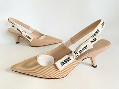 100% Authentic BEAUTIFUL  CHRISTIAN DIOR FABRIC & RIBBON BEIGE KITTEN HEEL SLINGBACKS !!!!! RETAIL PRICE IS $950+TAX!!!!      SIZE: 36.5  IT = 6.5 US !!! RUN TRUE TO SIZE!!!   BRAND NEW IN BOX WITH ONE DUSTBAG !!!      PLEASE KNOW YOUR SIZE IN THIS BRAND...PLEASE ASK ANY AND ALL QUESTIONS BEFORE BIDDING, I'M HAPPY TO ANSWER THEM ALL!!!  What you see in the photo’s is what you will receive. I do my best to give accurate and complete descriptions of the items. BRAND NEW IN BOX, NEVER BEEN WORN!!!! Beige Kitten, Dior Fabric, Dior Slingback, Kitten Heel Slingbacks, Ribbon Flats, Fabric Sandals, Elegant Pumps, Kitten Heel Shoes, Slingbacks