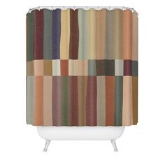 a shower curtain with multicolored stripes on the bottom and bottom, in various colors