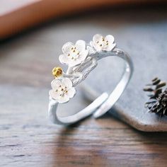 Up your style game with the stunning Silver Daisy Ring. This cute and elegant flower ring adds a classy touch to any outfit. It's adjustable too, making it a perfect gift idea. Embrace the floral vibes and treat yourself to this lovely piece. *Adjustable *925 stamped *This ring is stylish and pretty ideal for everyday use. * Gender: Female *Ready to Ship in 1-2 Business Days * The product will be sent to you nicely packages and ready for gift giving. * Visit our store, browse other jewelry, silver, and gold collections, and find the perfect piece you're looking for. This listing is for 1 piece of daisy ring.  ♥️ Look and favorite my shop ♥️ ♥️ New Models every week ♥️ Delicate Spring Flower Ring, Adjustable Flower Ring For Spring Wedding, Delicate Jewelry For Anniversary In Spring, Delicate Flower Ring For Spring Gift, Delicate Jewelry For Spring Anniversary, Delicate Spring Jewelry For Anniversary, Delicate Spring Flower Ring Gift, Spring Wedding Rose Gold Jewelry, Delicate Adjustable Rings For Spring