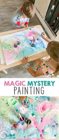 two children are painting with watercolors on a table and the text, magic mystery painting