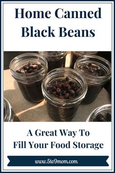 jars filled with black beans sitting on top of a counter next to the words home canned black beans