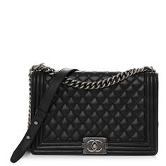 This is an authentic CHANEL Caviar Quilted New Medium Boy Flap in Black. This stylish shoulder bag is crafted of luxuriously soft diamond quilted lambskin leather with linear quilted borders in black. The bag features a ruthenium chain link shoulder strap with a leather shoulder pad and a matching Chanel boy CC push lock. This opens the full flap to a black fabric interior with zipper and flat pockets. High-end Quilted Shoulder Bag For Formal Occasions, High-end Black Quilted Bag, High-end Quilted Bags For Formal Occasions, High-end Quilted Formal Bag, High-end Formal Quilted Bags, Luxury Shoulder Bag With Diamond Quilting For Everyday, Elegant Leather Shoulder Bag With Diamond Quilting, Luxury Evening Shoulder Bag With Diamond Quilting, Everyday Luxury Black Quilted Bag