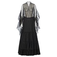 Check out this item from 1stdibs! Martin Margiela Artisanal Evening Dress Made Out Of Vintage Petticoats, ss 2003: https://www.1stdibs.com/id-v_21539362 Repurposed Vintage, Martin Margiela, Lining Fabric, Petticoat, Creative Director, Evening Dress, Dress Making, Vintage Designs, Tulle Skirt