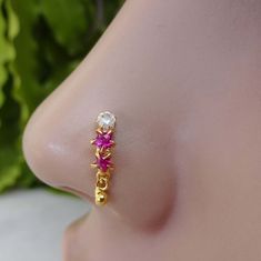 Detail of Product : -  Material : - 925 Sterling silver  Gemstone : -  Cubic Zirconia Gem Stone  Plating : - 14krt micron gold plating nickle free plating Color : - Gold Stone Color:-  White & Pink (as per Image) Width :- 3 MM Length :- 10 MM  Wire Gauge size : - 16 Gauge / 1.2 mm                                   18 Gauge / 1 mm                                   20 Gauge / 0.80 mm                                     22 Gauge/ 0.60 mm  We are using hypoallergenic and tarnish free nickle free pla Nose Piercing Stud Aesthetic, Indian Nose Piercing, Stud Aesthetic, Star Nose Stud, Nose Stud Indian, Nose Ring Indian, Unique Nose Rings, Curved Nose, Gold Nose Pin