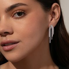 Crafted from half herringbone chain, half studded cubic zirconia stones, our Twin Flame Earrings are like nothing you’ve ever seen before. These have quickly become our new go-to holiday party earrings, and the best part is they come in silver and gold! For a full look, pair these statement earrings with a pair of simple stud earrings. Fine Jewelry Crystal Earrings With Cubic Zirconia For Party, Party Crystal Diamond Earrings In Fine Jewelry Style, Party Crystal Diamond Earrings, Diamond White Earrings For Party, Diamond White Sterling Silver Earrings For Party, Party Sterling Silver Diamond White Earrings, Party Sterling Silver Diamond Earrings, Party White Gold Diamond Crystal Earrings, Diamond White Dangle Earrings For Party