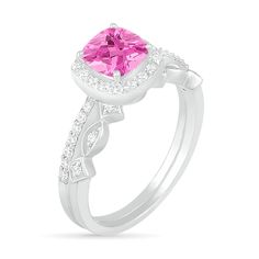 Proclaim your love in sophisticated style with this gorgeous gemstone and diamond bridal set. Crafted in cool 10K white gold, the elegant engagement ring showcases a 6.0mm cushion-cut lab-created bright pink sapphire wrapped in a frame of and atop a slender shank lined with sparkling petite diamonds. On your wedding day, complete her look with the coordinating art deco-inspired band adorned with a row of shimmering diamond-touched marquise and tilted-square shapes. Radiant with 1/4 ct. t.w. of d Promise Ring Bridal Sets With Diamond Accents And Moissanite, Moissanite Bridal Sets With Diamond Accents For Promise, Moissanite Bridal Sets With Halo Setting For Promise Ring, Moissanite Bridal Set With Halo Setting, Cubic Zirconia Princess Cut Wedding Ring With Accent Stones, Princess Cut Cubic Zirconia Wedding Ring With Accent Stones, Pink Sapphire Round Cut Wedding Jewelry, Dazzling Bridal Sets With Center Stone For Promise Ring, Pink Sapphire Round Cut Jewelry For Wedding