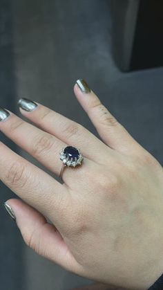 a woman's hand with a ring on it