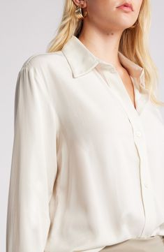 Cut in relaxed fit, this lightweight button-up shirt is what to wear on casual days whether you're in or out of the office. 29 1/2" length (size Medium) Front button closure Point collar Long sleeves with button cuffs 70% rayon, 30% lyocell Machine wash, line dry Imported Classic Long Sleeve Tops For Daywear, Classic Button-up Shirt With Back Button Closure, Classic Shirttail Hem Blouse For Spring, Classic Spring Blouse With Shirttail Hem, Classic Blouse With Shirttail Hem For Spring, Relaxed Fit Long Sleeve Blouse With Back Button Closure, Effortless Collared Shirt With Button Closure, Classic Shirt With Back Button Closure And Relaxed Fit, White Shirt With Hidden Button Closure For Spring