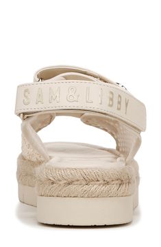 Gleaming hardware adorns the straps of an adjustable woven sandal fitted with a cushioned footbed for comfort and style. 1 3/4" heel Synthetic and textile upper/synthetic lining and sole Imported White Synthetic Sandals With Adjustable Strap, Beige Adjustable Sport Sandals With Round Toe, White Adjustable Strap Synthetic Sandals, Adjustable Beige Sport Sandals, Flat Sport Sandals With Adjustable Strap, Beige Adjustable Sport Sandals For Summer, Adjustable Beige Sport Sandals For Summer, Cream Sandals With Adjustable Strap For Summer, White Synthetic Sport Sandals With Adjustable Straps