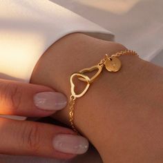 "❤️ Grab 3 fabulous items and enjoy a delightful 25% off when you use the code BUY3GET25 Express your love with our Gold-Plated Double Heart Initial Bracelet. This stunning charm bracelet is personalized with initials, making it a thoughtful and sentimental gift. The double heart design adds a touch of elegance and romance!  #YOU MAY LIKE THIS # HOW TO ORDER 1. Choose the color 2. Choose the coin 3. Click 'Add to Cart' 4. Write Customization on 'NOTE TO SELLER' Fill the option blank with prefer Heart Charm Double Heart Jewelry For Best Friend, Double Heart Charm Jewelry For Best Friend, Personalized Double Heart Gold Plated Jewelry, Minimalist Stainless Steel Heart Bracelet As Gift, Valentine's Day Friendship Name Bracelet, Gold Plated Charm Bracelet For Valentine's Day, Gold Charm Bracelet With Heart Charm For Mother's Day, Gold Heart Bracelet With Charms For Mother's Day, Elegant Heart-shaped Bracelets For Best Friend