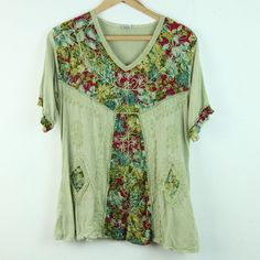 Vintage 90s/Y2K green multi embroidered rayon top. It is a free size style but it seems like a modern S/M depending on desired fit. There are some light spots on fabric, looks like part of the dye process but not sure. Please see all photos for condition and check the measurements for size. Shoulders 17" Sleeve 9 1/2" Chest 40" Length 25" CF Green V-neck Tops For Festival, Casual V-neck Top With Multicolor Embroidery, Spring Green Patchwork Blouse, Green Embroidered V-neck Blouse, Green V-neck Hippie Top, Green Floral Embroidered Crew Neck Blouse, Green Crew Neck Blouse With Floral Embroidery, Festival Floral Print V-neck Top, Green Embroidered Crew Neck Blouse