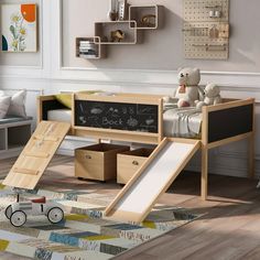 a child's bedroom with a chalkboard bed and slide