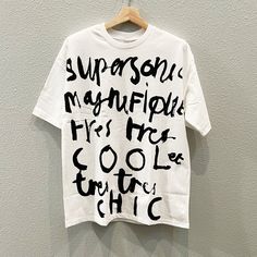 - Comfortable, Aesthetic, Abstract Graphic Tees for Men and Women. - 100% cotton - Pre-shrunk & Runs true to size - Shoulder-to-shoulder taping - Unisex size - Double-needle stitched sleeves and bottom hem - Quarter-turned to avoid crease down the middle Unisex Cotton T-shirt With Graffiti Print, Artsy Cotton T-shirt With Graphic Print, Unisex White T-shirt With Graffiti Print, Unisex Graffiti Print Graphic T-shirt, Casual T-shirt With Letter Print For Artistic Expression, Artsy Cotton Crew Neck T-shirt, Artsy Crew Neck T-shirt With Graphic Design, Graphic Design Cotton T-shirt, White Grunge T-shirt With Graphic Print