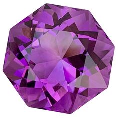 an amethyst purple diamond is shown on a white background