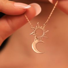 Looking for a unique and meaningful piece of jewelry? Our Sun and Moon Harmony Necklace embodies both balance and beauty, making it a perfect addition to any jewelry collection. Crafted with high-quality materials and expert attention to detail, this necklace features a beautiful sun and moon design that symbolizes harmony and balance. The pendant is crafted with intricate details and hangs from a delicate chain, making it a perfect piece for layering or wearing on its own. This Sun and Moon Har Sun And Moon Pendant, Sun And Moon Design, October Birthstone Necklace, North Star Necklace, Tiny Necklace, Chain Making, Lovers Necklace, Delicate Chain, The Cosmos