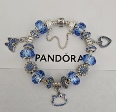 AUTHENTIC Pandora Barrel Clasp Bracelet These are purchased from Pandora and come with a receipt. While I use high quality beads and charms on the Pandora bracelet, the charms and beads used on the bracelet are NOT Pandora Brand, making the bracelet very affordable.  Beads and charms include: Blue single core diamond faceted beads, silver plated blue crystal butterfly charm, Blue crystal bead, silver plated blue crystal Kitty charm, silver plated blue crystal heart charm Includes Security Chain, Clasp Bead, Gift box and ships USPS Priority Mail Pandora Bracelet Shown is 7.9 with barrel clasp - Gona Bracelet 7.7 Sterling Silver white gold plated blue clasp Per Pandora  Make your jewelry the last thing you put on in the morning and first thing you take off at night. High & Dry Remove jewelry Dark Blue Pandora Bracelet, Blue Pandora Bracelet, Night High, Pandora Blue, Blue Charm, Butterfly Heart, Crystal Butterfly, Clasp Bracelet, Butterfly Charm