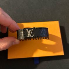 Men’s Bracelet. Brand New With Box, Perfect Condition. Black/Grey With Silver Lv And Clip. Lv Bracelet, Louis Vuitton Bracelet, S Bracelet, Uniqlo Bags, Louis Vuitton Men, Louis Vuitton Accessories, Louis Vuitton Damier Ebene, Mens Accessories Jewelry, Designer Accessories