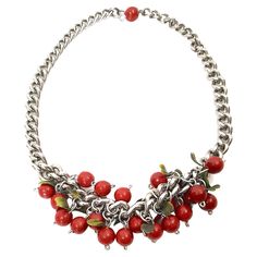 This vintage cherry-fruit charm necklace featuring red hand-painted wood is constructed of silver chain links and its clasp extension-chain is decorated with a single red bead. The green leaves that trim the berry beads are a surprising two-tone plastic, indicating that they were also handcrafted. Notably, the fashion designer Elsa Schiaparelli is famous for including custom plastic elements in her mostly unsigned jewelry that accompanied her couture collections in the late 1930s. Please see The Elsa Schiaparelli Jewelry, Couture Necklace, Vintage Cherry, Elsa Schiaparelli, Cherry Fruit, Chain Links, Hand Painted Wood, Green Tones, Red Bead