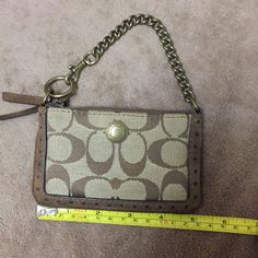 Never Used Brand New Condition. Coach Brown Coin Purse For Everyday, Brown Coach Pouch Clutch, Coach Rectangular Brown Coin Purse, Chic Brown Coach Wristlet, Brown Rectangular Coach Coin Purse, Formal Brown Coach Wristlet, Brown Coach Wallet With Interior Key Chain Holder, Coach Clutch Bag With Gold-tone Hardware, Coach Brown Wristlet With Zipper Closure