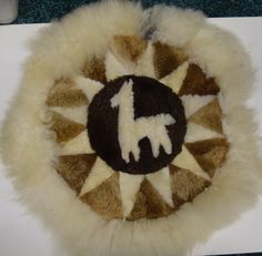 an animal rug with the letter f on it's center and letters in the middle