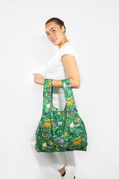 FEATURES Limited Edition 100% recycled & recyclable material shopping bag. Made from 6 recycled plastic bottles destined for our oceans. Water-resistant and lightweight. Strong stitching to carry those heavy loads up to 20kg. Large capacity fitting in 2-3 grocery bags of shopping. Folds into the attached small pouch and can fit into a pocket or handbag. Wide arms ensuring a comfortable fit around the shoulder. Green Reusable Shopping Bags, Casual Reusable Bags Made Of Recycled Materials, Casual Reusable Bags Made From Recycled Materials, Recyclable Shopping Bags Made Of Recycled Materials, Eco-friendly Reusable Bags Made Of Recycled Materials, Eco-friendly Green Grocery Bags, Eco-friendly Summer Bag From Recycled Plastic Bottles, Casual Bags Made Of Recycled Materials, Casual Bags Made From Recycled Materials