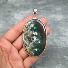 Moss Agate Pendant 925 Sterling Silver Pendant Moss Agate Gemstone Pendant Handmade Silver Jewelry Moss Agate Jewelry Gift For Her Mother The product details:- Gemstone- Moss Agate  Pendant Length- 8.5 CM Gemstone Shape- Oval (As shown in picture) Metal- 925 Sterling Silver Purity- 925 Parts Per 1000 Our Goal is 100% Customer Satisfaction  Note- "There might be a little difference in pendants as shown in photo because it is not possible for us to have the same stones." *We are continuously adding new products in our store. So keep coming back to see more great deals on store.* The perfect present for the special person in your life. Check Out Our Other Silver Pendants:- https://www.etsy.com/your/shops/JewelsByAditi/tools/listings/section:37124046 Click to visit our Shop:- https://www.etsy. Moss Agate Jewelry, Handmade Silver Jewelry, Agate Jewelry, Silver Jewelry Handmade, Silver Pendants, Agate Pendant, Agate Gemstone, Moss Agate, Sterling Silver Pendant