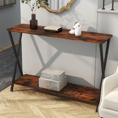 a wooden table sitting on top of a hard wood floor next to a white chair