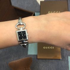 Authentic Gucci Watch Gucci Timeless Watch With Rectangular Dial, Gucci Timeless Rectangular Dial Watch, Gucci Formal Watch With Rectangular Dial, Elegant Gucci Watch With Rectangular Dial, Modern Gucci Jewelry With Round Dial, Timeless Gucci Evening Watch, Black Watches With Palladium Hardware, Gucci Watches With Metal Dial, Luxury Gucci Jewelry With Metal Dial