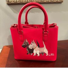 Stylish Handbag/Satchel With Two Embroidered Scottish Terriers At The Center Front. Embroidered With "Lrl" Monogram Branding At The Corner Of It. Interior: Center Zip Pocket, Small Zip Pocket On Side, Open Pocket Comes With Dust Bag Approx. 10.5'' L X 7.75 "H 4.75" D Designer Red Embroidered Bag, Ralph Lauren Holiday, Navy Purse, Ralph Lauren Handbags, Scottish Terriers, Patent Leather Bag, Ralph Lauren Bags, Ralph Lauren Leather, Black Satchel