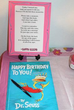 a dr seuss birthday card and book on a table