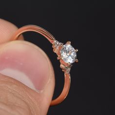 "Rose gold ring, Women engagement ring, Rose gold engagement ring, Promise ring, Minimalist ring, Small ring, Tiny ring, Delicate ring WE OFFER UNLIMITED PERIOD INSTALLMENTS PLAN This is a beautiful, stunning, feminine ring that works well for all occasions, styles, and ages. You will love it! Ring information: Main stone: White cubic zirconia Approximate size: 5mm Accent stones: Cubic zirconia Metal type: Gold Metal stamp: 14k Gold Customization / Replacements It's easy to create jewelry that's Rose Gold Open Ring Stackable Promise Rings, Dainty Solitaire Rose Gold Stackable Rings, Dainty Solitaire Ring For Proposal, Promise Midi Rings In Rose Gold With Ethical Diamonds, Dainty Round Cut Diamond Ring For Proposal, Dainty Round Cut Ring For Proposal, Dainty Round Cut Diamond Proposal Ring, Rose Gold Open Ring Midi Rings For Promise, Rose Gold Promise Midi Rings With Round Band