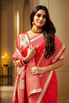 A Red Floral Woven Saree. It has intricate design all over the saree. This saree is a suitable amalgamation of style and grace that is required from an ethnic wear. The saree is ideal for any formal gathering. The saree comes with an unstitched blouse of corresponding color and design as shown in the picture. Fabric Type: Soft Banarasi SilkColor: ﻿RedSaree Length: 6.3 meters including 0.8 meter blouseBlouse Material: Cotton SilkWashing Instructions: Dry Clean Only Red Color Party, Sequence Blouse, Saree Petticoat, Indo Western Gown, Kurtis Tops, Full Sleeve Blouse, Saree Jewellery, Color Party, Lehenga Skirt