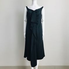 Simple, Elegant And Sophisticated Sleeveless Dress With A Vintage Flair. Wide Scoop Neckline. Zip Front With Hook And Eye Closure. Cascading Ruffles On Front. A-Line Silhouette. Unlined. Made In Italy. Color: Black. Fabric: 100% Silk. Size: It 44 / Us 8. Measurement When Garment Laid Flat Approximately - Bust: 18”, Waist: 17”, Hips: 20”, Length: 42” (50”Including The Front Ruffle). Nwt (Store Tag Only, No Original Hangtag). Never Worn. Store Handled. Can Provide More Info And Pictures. Pre-draped Sleeveless Evening Dress With Ruffles, Pre-draped Sleeveless Dress With Ruffles, Pre-draped Sleeveless Dress For Dinner, Evening Midi Dress With Ruffles And Draped Shape, Draped Midi Dress With Ruffles For Evening, Evening Midi Dress With Draped Ruffles, Formal Sleeveless Evening Dress With Ruffles, Elegant One-shoulder Sleeveless Dress With Ruffles, Draped Ruffle Midi Dress For Evening