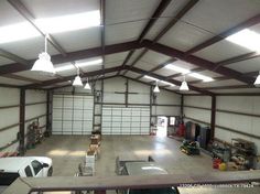 an overhead view of a garage with lots of storage space and lights hanging from the ceiling