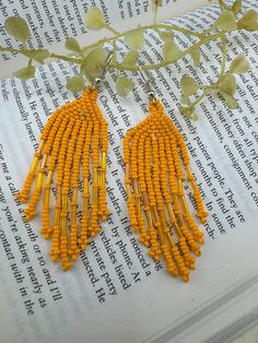 This is a beautiful Quirky beaded Long Earrings in Beautiful Yellow/Mustard Yellow color for party lovers. Very light weight to wear and looks good on any attire. This is very beautiful to look at and a perfect one for regular wear and also parties.  Color : Yellow length : 3 inch width : 1 inch Each earring Weight : 3.82 grams Material : Beads Beautiful High Quality, premium jewelry. Free US standard shipping. Hand crafted in India with the finest design, this earring is of premium quality and Mustard Yellow Color, Boho Earring, Premium Jewelry, Quirky Earrings, Beaded Earring, Earring Handmade, Handmade Earring, Boho Aesthetic, Statement Earring