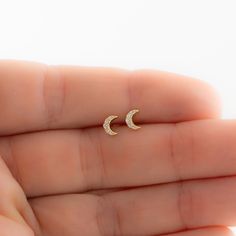 Such a cute, and dainty pair of earrings! They're perfect alone or stacked. They're a tiny pair that are perfect for second piercings, cartilage piercings, or for a minimalist touch. ✤✤ Details ✤✤ ★ Made of 925 Sterling Silver ☾ We use a THICK plating of 14k Gold or Rhodium for a piece that is sure to last you years to come ★ Sold as a PAIR ☾ Nickel-free & Hypoallergenic ★ Measures 5 mm x 4 mm ☾ We use the highest grade of cubic zirconia for an authentic diamond look Comes in a cute gift box Dainty Moon Phase Earrings, Dainty Moon Shaped Hypoallergenic Earrings, Dainty Moon-shaped Hypoallergenic Earrings, Dainty Hypoallergenic Moon-shaped Earrings, Dainty Half Moon Charm Earrings, Dainty Hypoallergenic Moon Earrings, Dainty Half Moon Earrings With Moon Charm, Dainty Moon-shaped Earrings, Dainty Moon-shaped Moon Phase Earrings