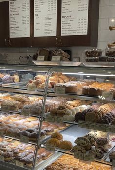 a bakery filled with lots of different types of doughnuts