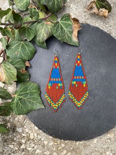 Brown blue woven earrings, abstract seed beaded earrings, fringe small earrings, Triangle Bohemian, festival earrings, Boho earrings Hippie ♥𝑇ℎ𝑒 𝑝𝑎𝑡𝑡𝑒𝑟𝑛 𝑜𝑓 𝑡ℎ𝑖𝑠 𝑒𝑎𝑟𝑟𝑖𝑛𝑔 𝑖𝑠 𝑐𝑟𝑒𝑎𝑡𝑒𝑑 𝑏𝑦 𝐾𝑎𝑍𝑒𝐵𝑒𝑎𝑑𝐽𝑒𝑤𝑒𝑙𝑟𝑦 ♥𝑀𝑎𝑑𝑒 𝑢𝑠𝑖𝑛𝑔 𝑓𝑟𝑒𝑒ℎ𝑎𝑛𝑑 𝑏𝑒𝑎𝑑𝑖𝑛𝑔 𝑤𝑜𝑣𝑒𝑛 𝑡𝑒𝑐ℎ𝑛𝑖𝑞𝑢𝑒𝑠 𝑤𝑖𝑡ℎ 𝑠𝑡𝑟𝑜𝑛𝑔 𝑠𝑦𝑛𝑡ℎ𝑒𝑡𝑖𝑐 𝑡ℎ𝑟𝑒𝑎𝑑. ♥𝑇ℎ𝑒 𝑠𝑖𝑧𝑒 𝑜𝑓 𝑡ℎ𝑒 𝑠𝑒𝑒𝑑 𝑏𝑒𝑎𝑑𝑠 𝑢𝑠𝑒𝑑 𝑖𝑠 2 𝑚𝑖𝑙𝑙𝑖𝑚𝑒𝑡𝑒𝑟𝑠 𝑎𝑛𝑑 𝑏𝑒𝑎𝑑𝑠 𝑎𝑟𝑒 ℎ𝑖𝑔ℎ 𝑞𝑢𝑎𝑙𝑖𝑓𝑖𝑒𝑑. ♥𝐴𝑙𝑙 𝑡ℎ𝑒 ℎ𝑜𝑜𝑘𝑠 𝑢𝑠𝑒𝑑 𝑖𝑛 𝑜𝑢𝑟 𝑗𝑒𝑤𝑒𝑙𝑟𝑦 𝑎𝑟𝑒 24 𝑘 𝑔𝑜𝑙𝑑 𝑝𝑙𝑎𝑡𝑒𝑑 𝑎𝑛𝑑 ℎ𝑦𝑝𝑜𝑎𝑙𝑙𝑒𝑟𝑔𝑒𝑛𝑖𝑐. ♥𝑇ℎ𝑒𝑠𝑒 𝑎𝑟𝑒 𝑣𝑒𝑟𝑦 𝑙𝑖𝑔ℎ𝑡 𝑒𝑎𝑟𝑟𝑖𝑛𝑔𝑠 𝑡ℎ𝑎𝑡 𝑦𝑜𝑢 𝑐𝑎𝑛 𝑤𝑒𝑎𝑟 𝑎𝑙𝑙 𝑑𝑎𝑦 𝑤𝑖𝑡ℎ𝑜𝑢𝑡 ℎ𝑢𝑟𝑡𝑖𝑛𝑔 𝑦𝑜𝑢𝑟 𝑒𝑎𝑟! The on Handmade Tassel Earrings For Festivals, Handmade Unique Tassel Earrings For Festivals, Bohemian Blue Earrings With Fringe, Blue Bohemian Earrings With Fringe, Blue Fringed Beaded Earrings For Festival, Handmade Bohemian Tassel Earrings For Festivals, Multicolor Handwoven Tassel Earrings Gift, Handwoven Multicolor Tassel Earrings Gift, Blue Fringe Earrings For Festivals