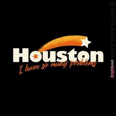 houston i have so many problems logo on black background with orange and white stars in the center