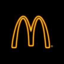 a neon mcdonald's logo on a black background