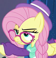 the pinkie is wearing glasses and looking at something