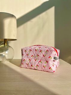 This handmade makeup bag is perfect for travel or to store your favorite products! Cute Rectangular Cosmetic Bag For Travel, Pink Square Pouch For Daily Use, Pink Bags With Removable Pouch In Rectangular Shape, Cute Rectangular Cosmetic Bag For Daily Use, Pink Rectangular Box Bag For Daily Use, Cute Rectangular Shoulder Bag With Zipper Pouch, Portable Tote Box Bag For Gifts, Pink Rectangular Everyday Use Bag, Pink Rectangular Everyday Bag