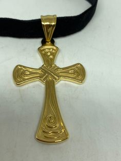 vintage Celtic golden Stainless Steel Cross pendant necklace Very solid Gothic cross Vintage design Silver stainless steel About 1.5 inches Hangs on a velvet ribbon, Can be worn on a chain. All jewelry is shipped in a nice gift box. Check out our over a THOUSAND great reviews Gold Spiritual Cross Necklace In Stainless Steel, Gold Stainless Steel Spiritual Cross Necklace, Gold Metal Cross Necklace As Gift, Gold Stainless Steel Cross Necklace As Gift, Gold Stainless Steel Cross Necklace For Gift, Vintage Gold Cross Necklace For Gift, Stainless Steel Cross Pendant, Gothic Cross, Gothic Crosses