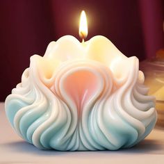 a close up of a candle on a table