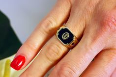 "This signet ring is unique in its design and style. It is made of 14k//18k gold (per your choice), a black enamel bed upon which the gold letter luxuriously and boldly shines, with a black diamond set on each side. This initial ring is vintage and art deco inspired. It has clean lines and delicate decorating. It can be personalized by a meaningful letter, initials, or a word, and become special & emotionally valuable, as well as a luxurious ornament. You can select your favorite font from the o Black Signet Ring, Custom Gold Rings, Gold Initial Ring, Gold Pinky Ring, Diamond Signet Ring, Oval Diamond Engagement, Mens Gold Rings, Ringe Gold, Gold Letter