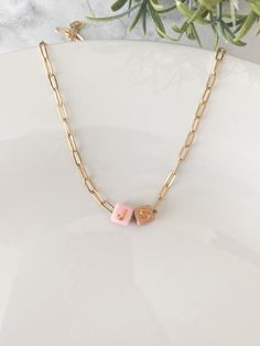 Discover our exquisite Initial Paper Clip Chain Necklace Gold, perfect as a custom name necklace for mom. Our jewelry collection also features a dainty gold layered necklace set adorned with beads ✨Necklace Details✨ - Made of Stainless Steel- Gold Plated - Tarnish Resistant - 18" & 20" length options available - Multicolored Gold Letter Beads Take a look at our other accessories.  https://www.etsy.com/shop/Wild4Style?ref=seller-platform-mcnav 📦Shipping & Packaging📦 All orders will be packaged securely to ensure a safe delivery. Orders will be processed and shipped within 1-7 business days.  If you need it sooner, I provide a rush order option.  RUSH ORDER ADD ON https://www.etsy.com/listing/1717364098/rush-order-add-on-listing?click_key=e548fd443fe262a6e7d55b87615fbaeaee16e2f5%3A17173640 Customizable Gold Chain Necklace For Gifts, Personalized Chain Necklace For Mother's Day, Personalized 14k Gold Filled Necklace For Mom, Personalized Gift Charm Necklace With Adjustable Chain, Personalized 14k Gold Filled Necklaces As Gifts, Adjustable Gold Beaded Necklace With Letter Beads, Personalized Initial Pendant Chain Necklace As Gift, Mother's Day Necklace With Round Letter Beads, Mother's Day Personalized Initial Necklace With Letter Beads