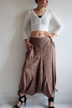 Beautiful double layer fabric made of cotton/linen blend.  High quality and stunning beauty. The fabric is unbleached and undyed, you can see the bark fibres in it! Subtle stripe patternDrop-crotch style pants, baggy pants, tribal pants with a twist.3 ways to wear. with drawstring on the hem. You can wear it with drawstring loose. Like a wide leg pants. Even look like A shape sweet skirt.You can also draw the string and get a balloon shape pants.Or...you can put the hem above your knee and get a Fitted Cotton Harem Pants For Festivals, Bohemian Harem Trousers For Fall, Hippie Style Cotton Pants For Fall, Fall Bohemian Harem Pants, Bohemian Harem Pants Ankle-length For Fall, Bohemian Brown Cotton Harem Pants, Brown Cotton Harem Pants For Fall, Bohemian Ankle-length Harem Pants For Fall, Bohemian Style Ankle-length Wide Leg Cotton Pants