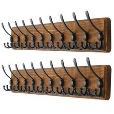 two wooden racks with black metal hooks on them