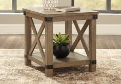 a small wooden table with a plant in it on top of a carpeted floor